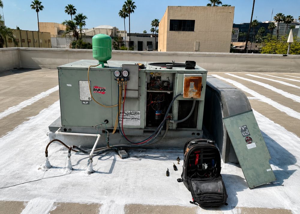 Rooftop HVAC package unit opened for preventive maintenance